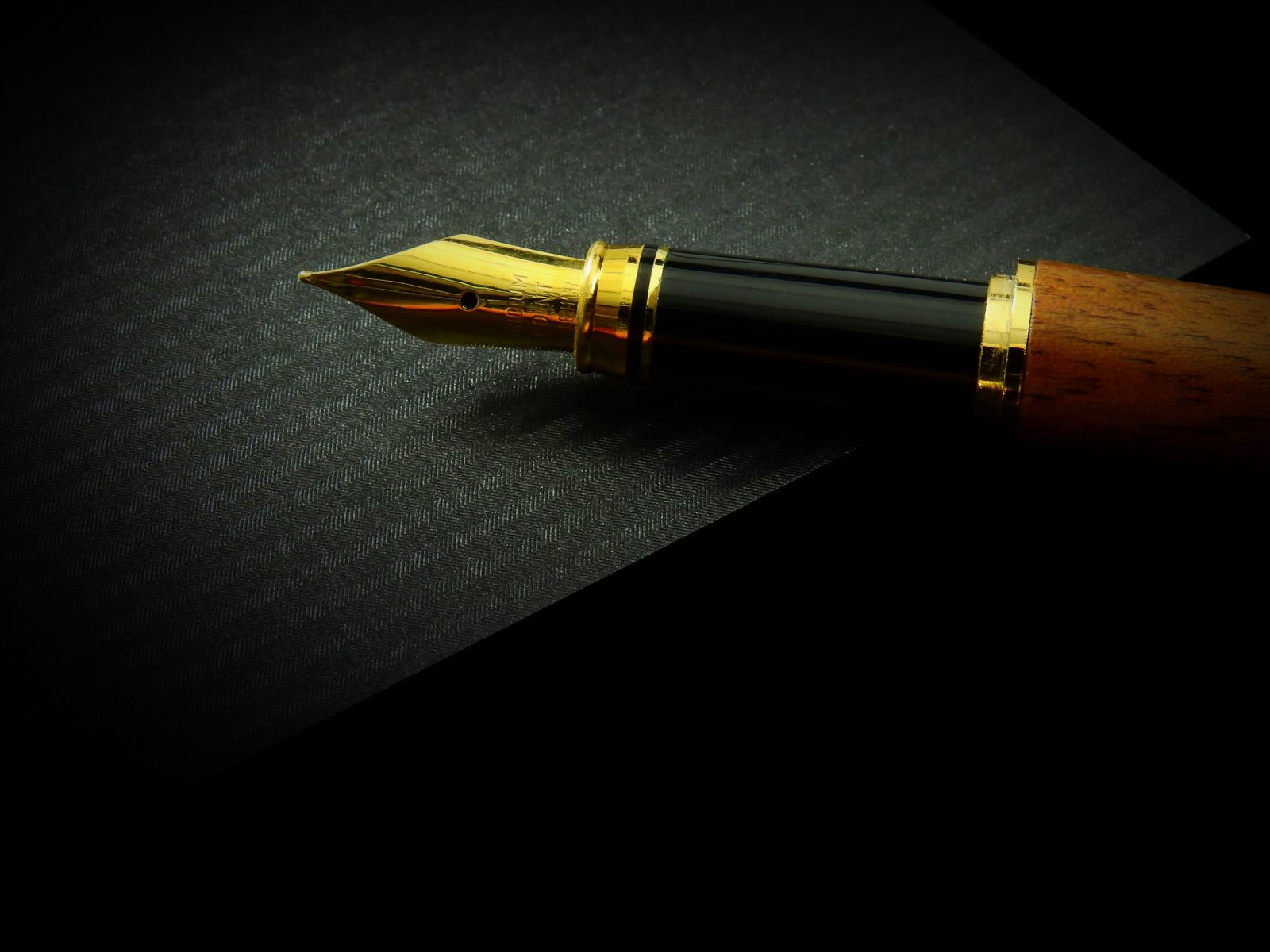 A Fountain pen without a cap on a table